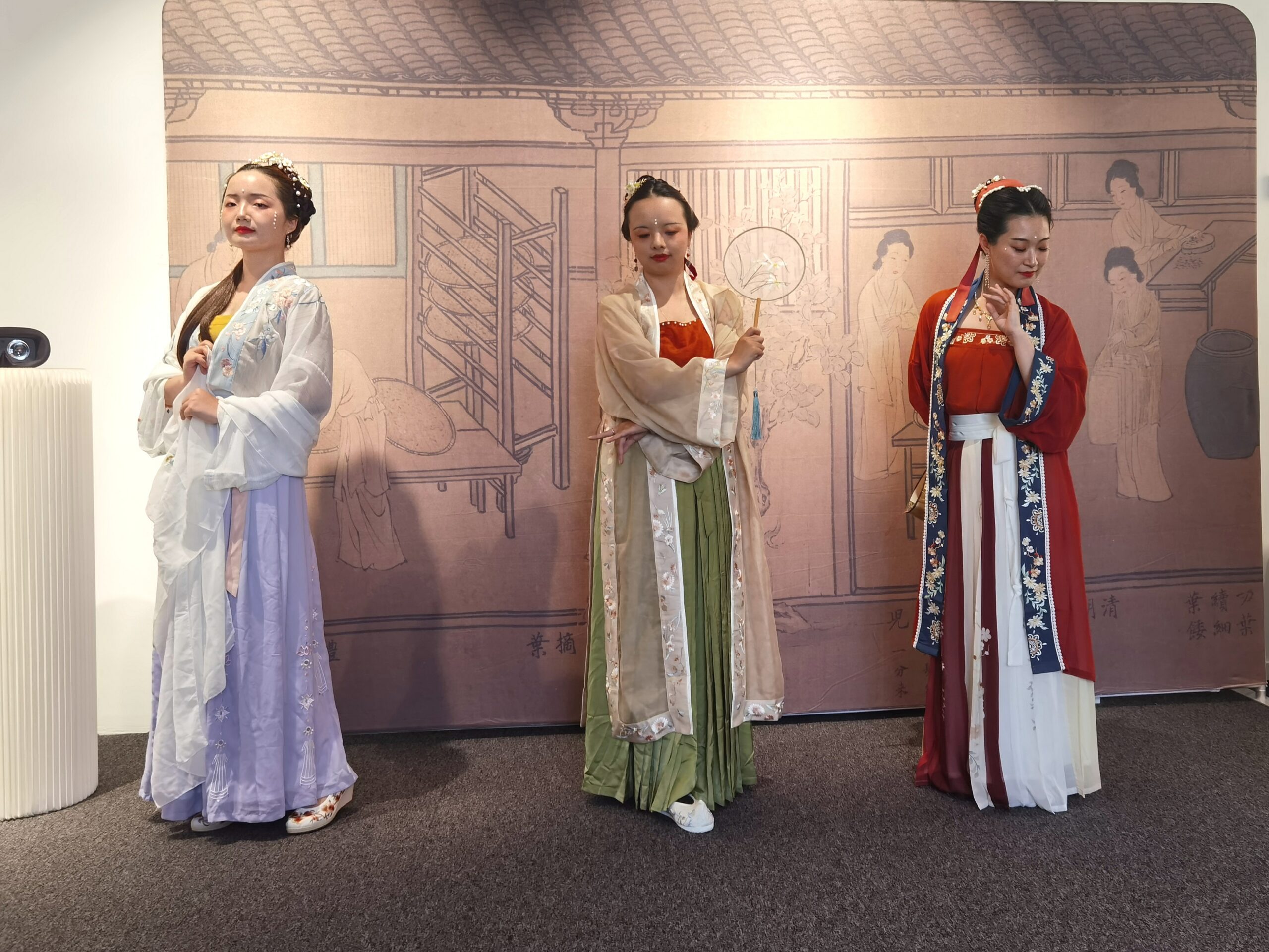 Three Hanfu presenters during a cultural event